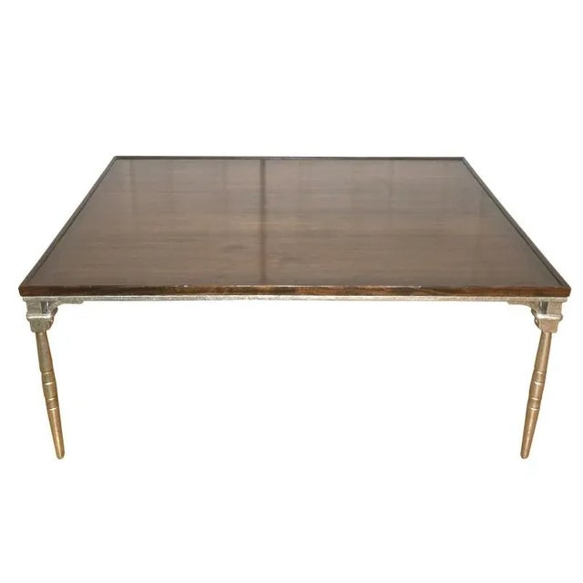 Large-scale coffee table from luxury furniture maker Dessin Fournir. Hand-made in Los Angeles with a solid mahogany top...
