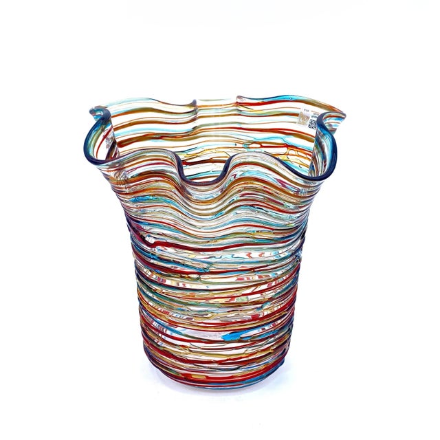 Find the pleasure of Made in Italy quality in this Murano glass vase, with filaments that fade from amber to red and...