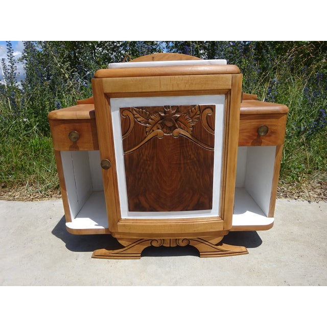 Light wood bedside table, Art Deco period and style. One large central cupboard with a burr walnut door and original knob...
