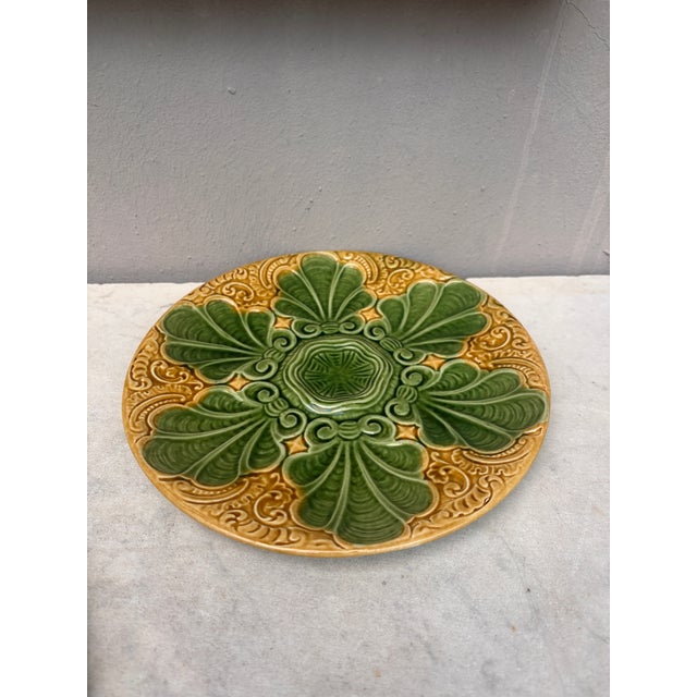Colorful French Majolica green and yellow oyster plate with stylized leaves, circa 1890.