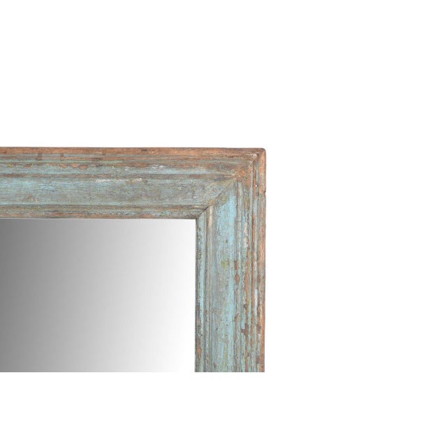 This Antique Indian Painted Teakwood Mirror was handcrafted over a century ago, featuring a classic rectangular frame with...