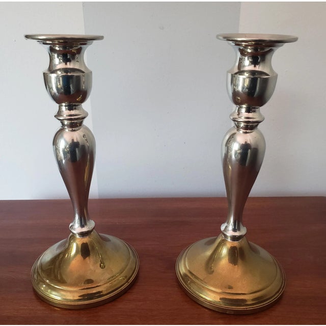 Pair of 1960s weighted web pewter candle holders. Dual Silver and brass tone. Very Good condition. Measure 4" in diameter...