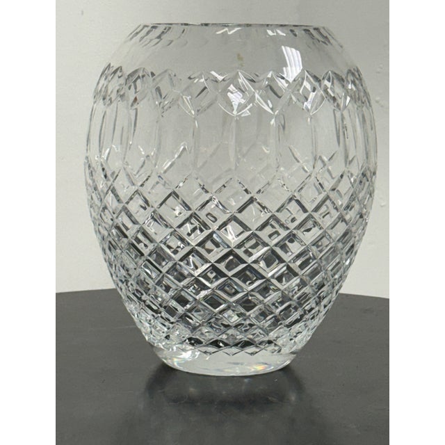 Design Plus Gallery presents a Vintage Cut Crystal Oval Vase. This decorative crystal vessel has a rounded oval form with...