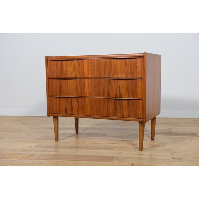 Mid Century teak dresser made and manufactured during the 1960s in the Denmark. The dresser has profiled handles. The...