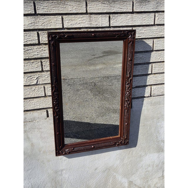This product is a 19th century American walnut Victorian hallway mirror that is handcrafted and features a rectangular...