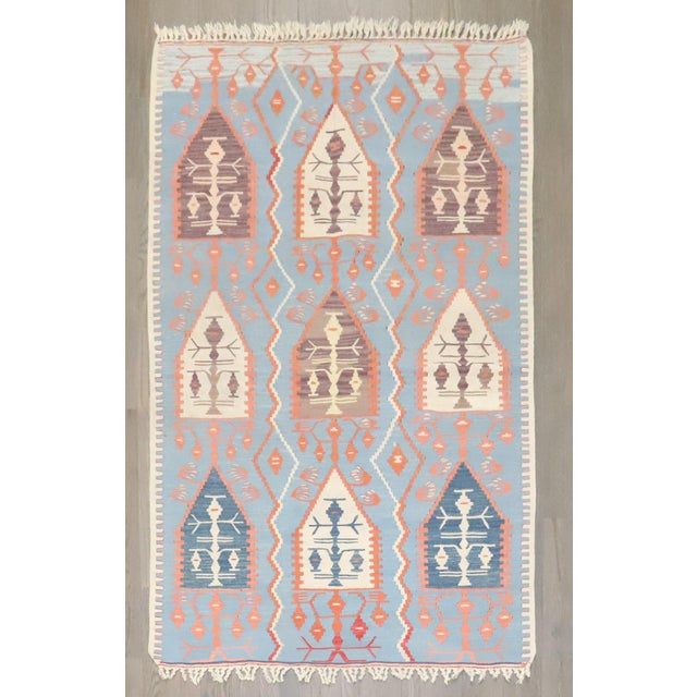 a mid-20th century tribal turkish kilim in predominantly light blue Measures: 3'7'' x 5'5''