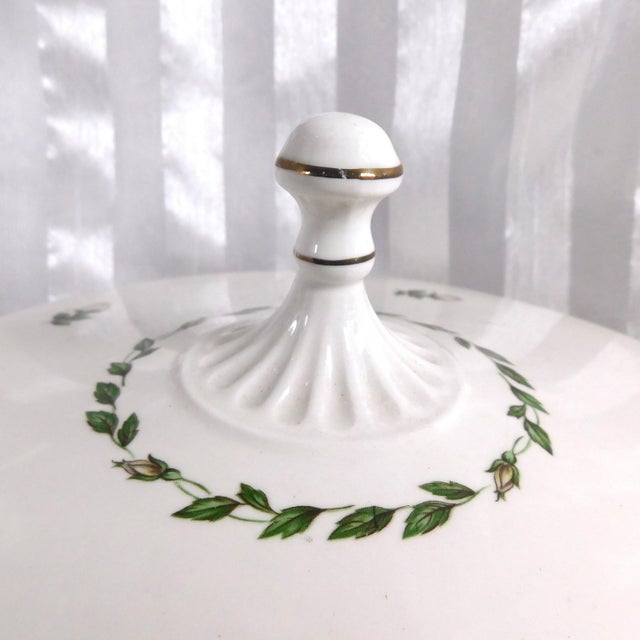 This is a Halls footed covered round vegetable dish in the Cameo Rose pattern from 1951. The dish is white with a green...