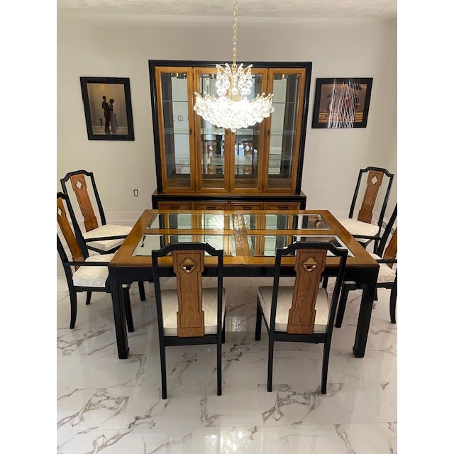 There are two beautiful leaves for this table and pads for everything. However, the table pads are a little warped in a...