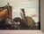 A charming original oil painting, circa 1960s, depicting a quiet coastal harbor scene. A lone figure stands on a weathered...