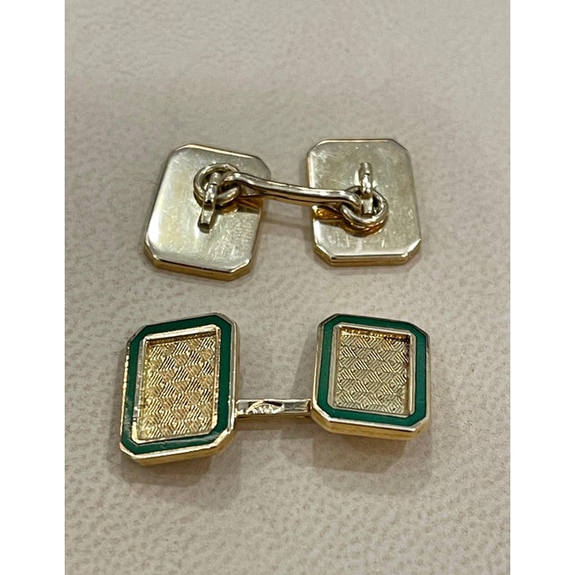 Its Vintage Classic cufflinks in high-polished 18 karat yellow gold, with green enamel on the periphery. Fronts and back...