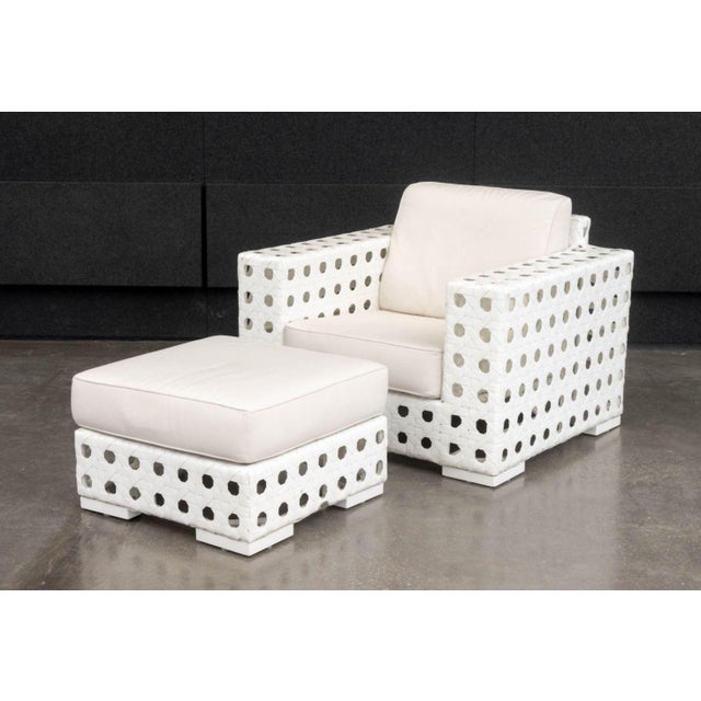 Skyline Design Lounge Chair and Ottoman, with white woven plastic frames and beige cushions. Chair: 36" H x 42" W x 36" D;...