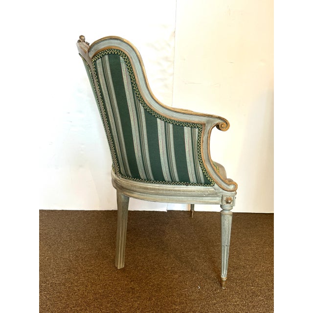 1900s Antique Carved Chairs With Green Stripe Fabric. The wood frame has a light green hand-painted color, with gold...