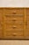 1970s sideboard featuring a bamboo structure with surfaces covered in woven rush. Configured with two side doors and four...