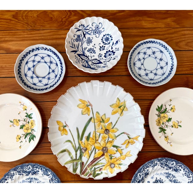 Yellow and Blue Floral Wall Plate Collection (9 Pieces) A curated 9‑piece vintage wall‑plate gallery blending...