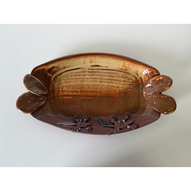 A beautifully handcrafted studio pottery tray signed by Helen Helwig, featuring a distinctive Southwestern design. The...