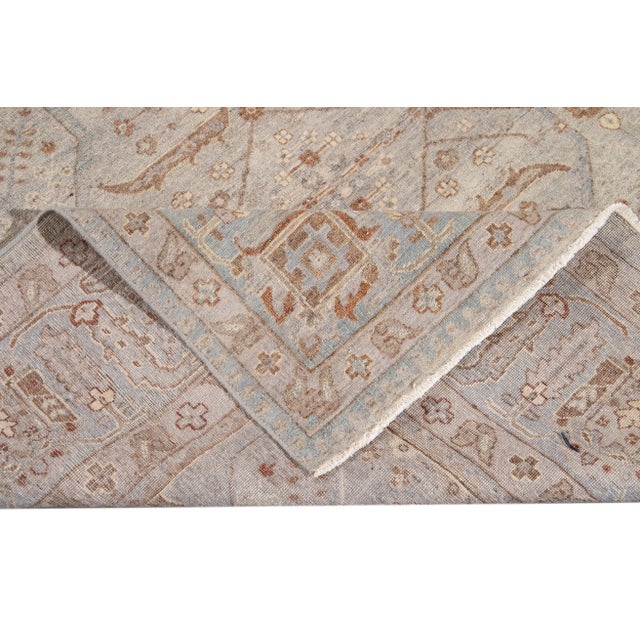 Beautiful modern hand-knotted Indian wool rug with a gray field, beige, brown, and blue accents with an all-over geometric...