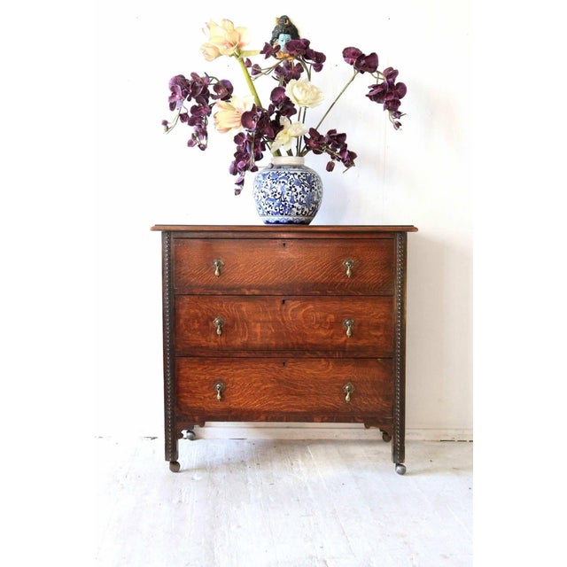 Antique Oak Chest of Drawers on Castors with Brass Handles and Carved Details For Sale - Image 6 of 7
