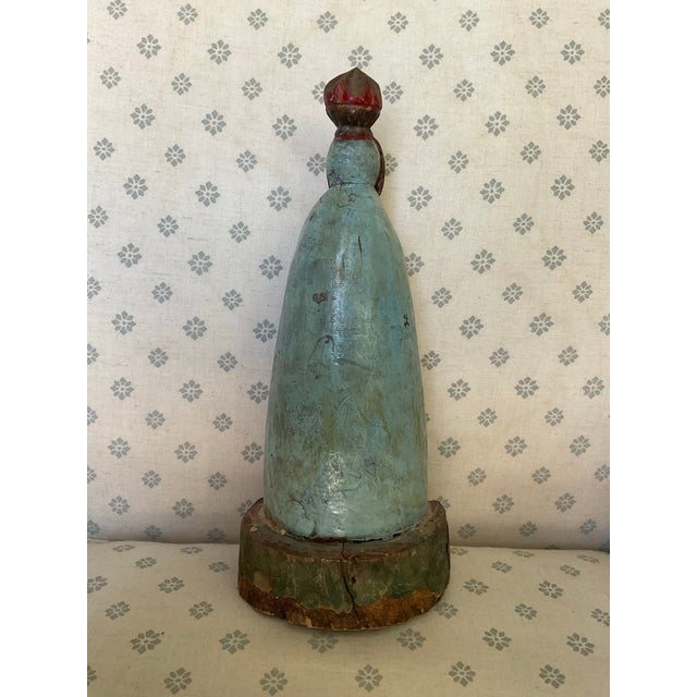 This charming 12-inch figure depicts the Virgin Mary with two kneeling children, adorned with delicate floral and rosary...