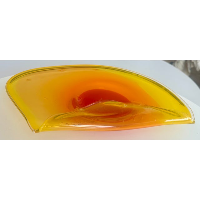 A beautiful orange Murano hand-blown glass bowl. The " Sommerso" technique shows the mastery of Italian glassblowers. A...