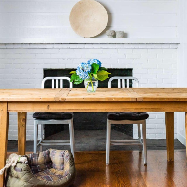 Product Description A striking set of four authentic Emeco side chairs in brushed aluminum, dating to the 1990s. Clean-...