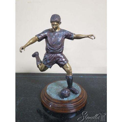 Age: Approx. 5 Years Old Description: Model 8236-10 (old #1060-063) Bronze soccer player on wood base fine details Offered...