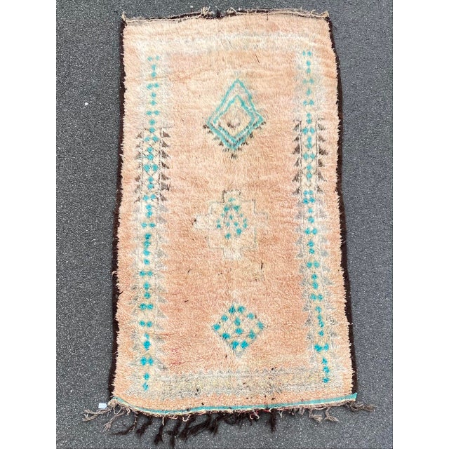 Hand-woven by the Berber women in the Atlas Mountains, this rug is created with soft natural wool fibers from the tribe’s...