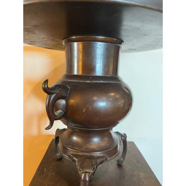 This impressive antique Japanese bronze tazza dates to the Meiji Period (18681912). Originally a monumental tripod...