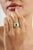 This Vintage Style Cushion Cut 1.2 Ct Emerald & Diamond Halo Signet Ring is crafted in 925 sterling silver and features a...