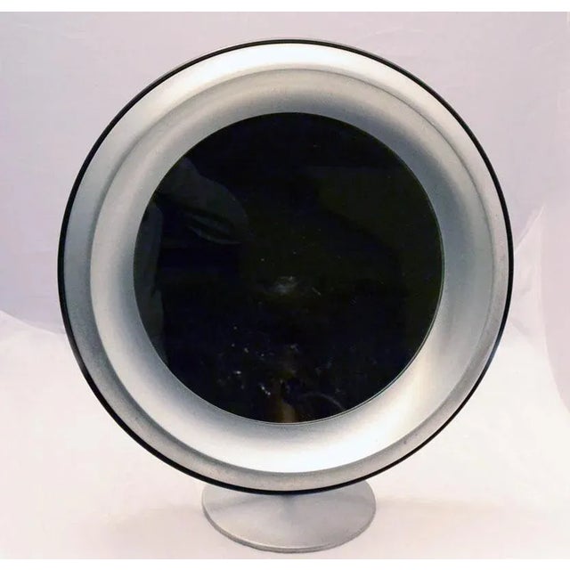 - Round mirror in brushed steel - With an adjustable construction - Produced by Missaglia in the 70s - Marked on the back