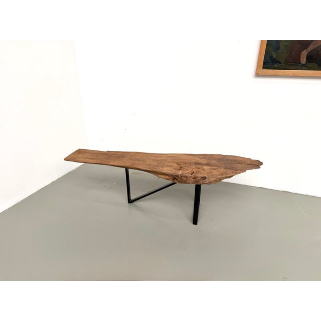 Maison lecan presents this coffee table with its brutalist and organic design, dating from the 1990s. its unique solid...