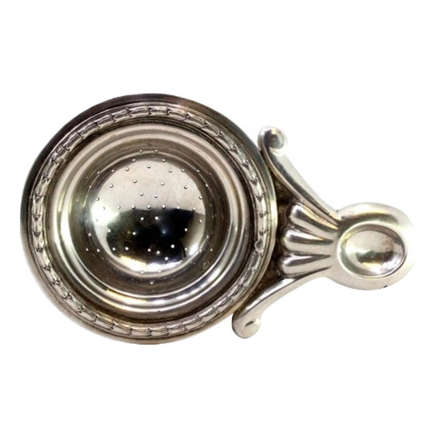 Silver Tea Strainer with Reliefs and Applications For Sale