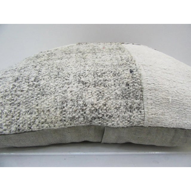 This is a pillow cover made from a vintage kilim rug. The piece was properly washed and ready to use. Pillow inserts not...