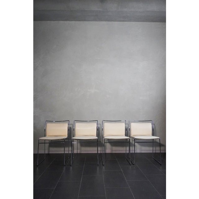 Tulu model chairs by Kazuhide Takahama for Gavina, in polished steel and original cream-colored vinyl, very light and...