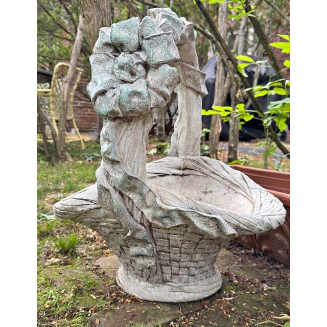 Hand-cast stone planter with woven basket detail and large ribbon bow; studio-signed. Charming mid-century cast-stone...