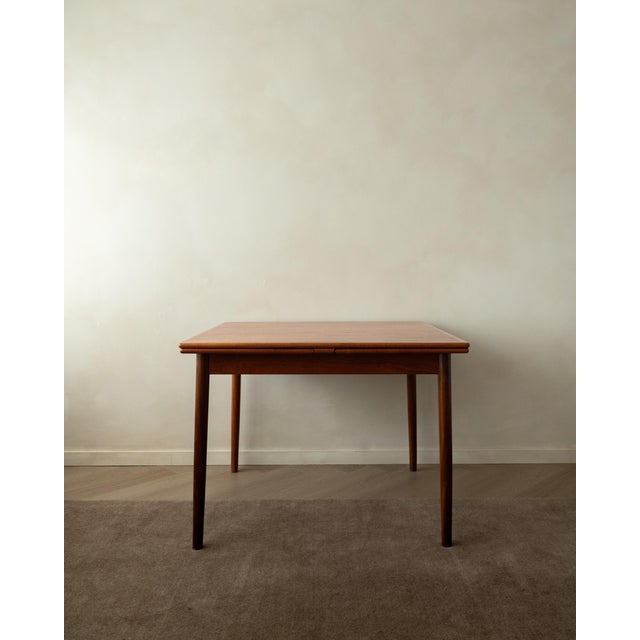 A vintage danish modern teak extendable dining table, model 24, made by am møbler / ansager møbler in denmark during the...