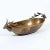 An elongated brass bowl with deer heads at either end, formed of pounded brass. Very rustic with a folk art appeal.
