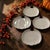 Add a charming touch to your autumn celebrations with this white ceramic pumpkin-shaped plate. Features a clean, neutral...