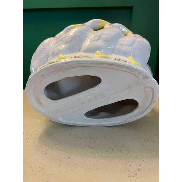 Vintage Holland Mold circle of geese bowl. The geese are white with hand painted eyes, beaks and feet. A green grass...