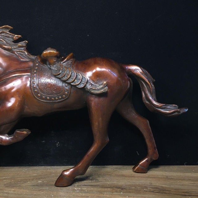 Bring dynamic energy and prosperity to your space with this impressive vintage-style solid bronze horse sculpture. In...