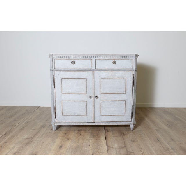 This 19th-century Swedish sideboard, circa 1870, is a beautiful example of Gustavian design, showcasing its characteristic...