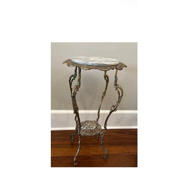 Unique Victorian marble and brass side table served as a great accent piece in many rooms in m settings. A great piece of...