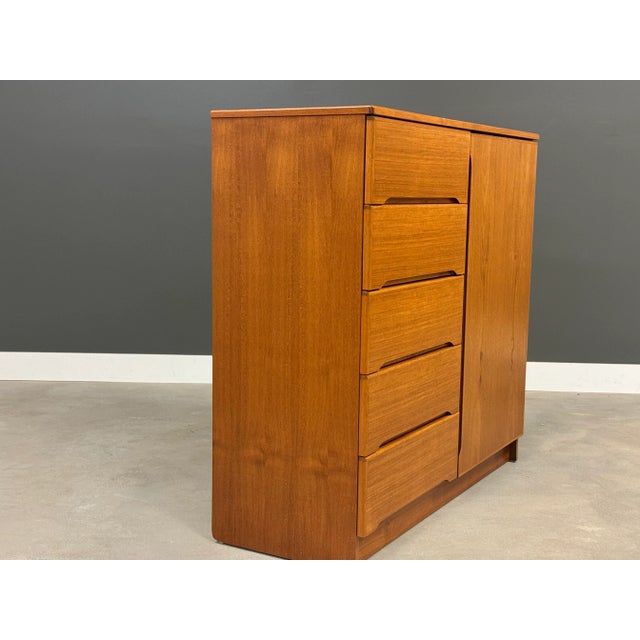 A mid century modern teak armoire with a swinging door and adjustable shelving. Made in Denmark. Circa 1970’s. Excellent...