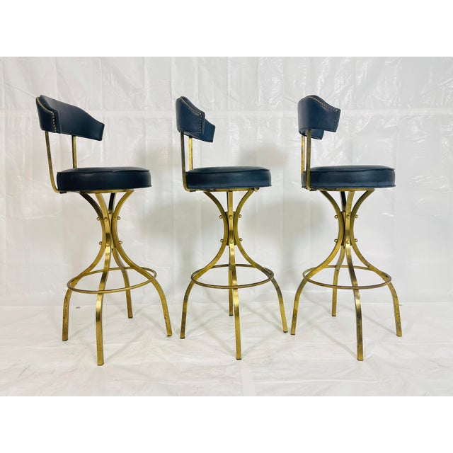An iconic set of three “Sinatra” bar stools designed and manufactured in the 1960s in Los Angeles, California Attributed...