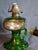 Offering a rare and visually striking antique emerald green glass kerosene finger lamp. This piece features a unique...