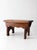 This early 20th century wooden farmhouse stool features a solid oak top, scalloped apron, and cutout legs with a...