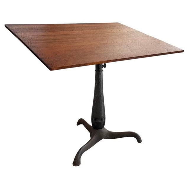 This early 20th century industrial adjustable architect's desk or drafting table is circa the 1920s. The 42" w x 32" ht...