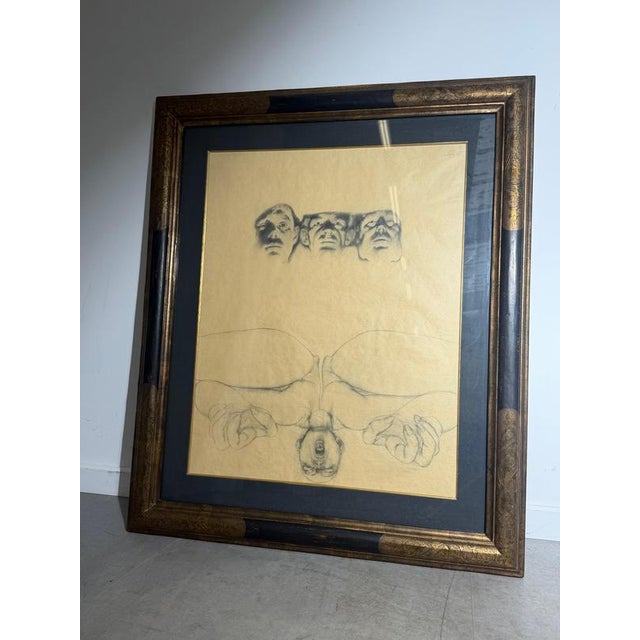 Expressive graphite drawing by René Knapen, featuring a surreal composition of three faces above an inverted figure with...