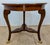 Mahogany with Satin Wood and Mahogany Parquetry top. Cabriole leg with brass acanthus leaf ormolu sitting on brass claw...