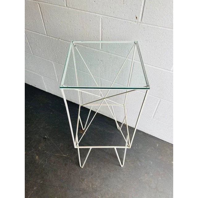 Geometric iron base adds understated spunk where it lands. Can be used as a plant stand, funky bedside table or accent...