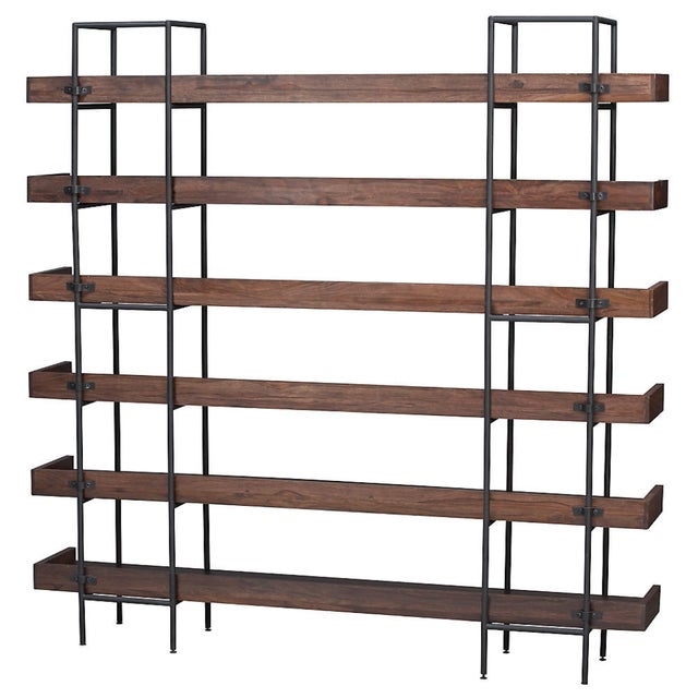 Expansive shelving anchors family room, office or kitchen with open styling that puts books and dinnerware on display....